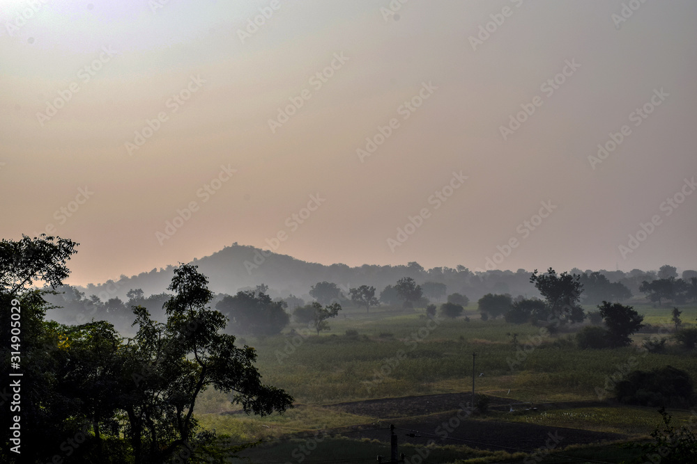 Picture of early morning sun rise view in indian village