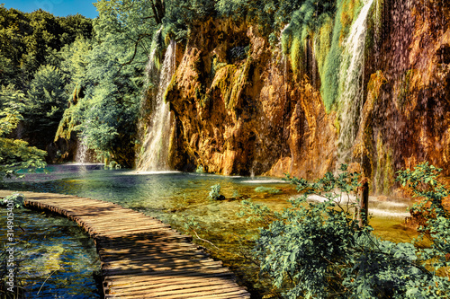 Fototapeta Naklejka Na Ścianę i Meble -  Picturesque summer scene of green forest with pure water waterfall in Plitvice National Park. Bright countryside landscape of Croatia, Europe. Beauty of nature concept background. Retro filtered.