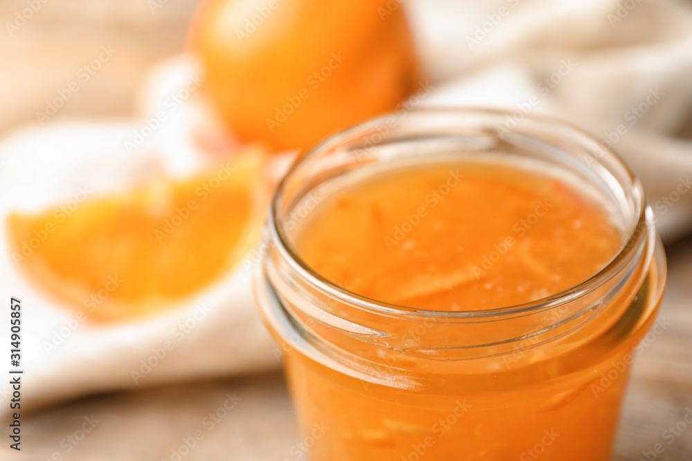 Homemade delicious orange jam on table, closeup view Homemade delicious orange jam on table, closeup view