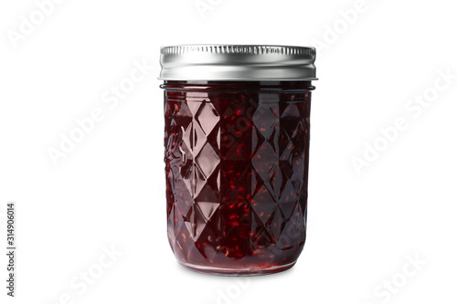 Jar of raspberry jam isolated on white