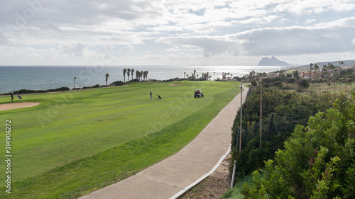Campo de golf en la provincia de Cadiz, con el peñón de Gibraltar al fondo photo