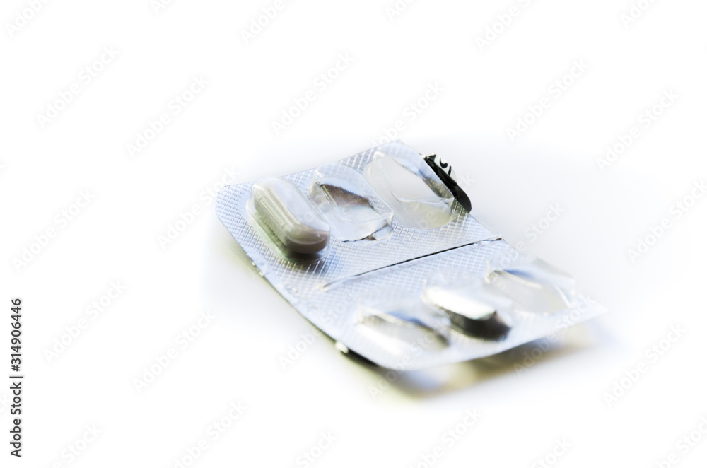 Empty pill box. White pill in plastic cap and aluminum foil from the opposite side. Pharmaceutical drugs for sick people. Research and development of human immunity. Healthy lifestyle Empty pill box. White pill in plastic cap and aluminum foil from the opposite side. Pharmaceutical drugs for sick people. Research and development of human immunity. Healthy lifestyle
