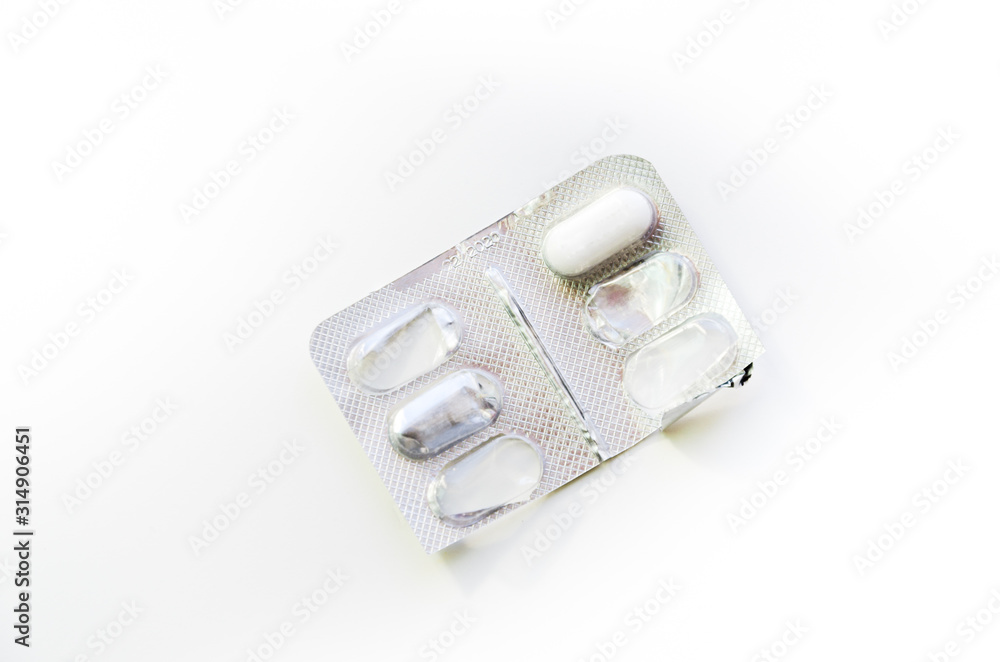 Empty pill box. White pill in plastic cap and aluminum foil from the opposite side. Pharmaceutical drugs for sick people. Research and development of human immunity. Healthy lifestyle Empty pill box. White pill in plastic cap and aluminum foil from the opposite side. Pharmaceutical drugs for sick people. Research and development of human immunity. Healthy lifestyle