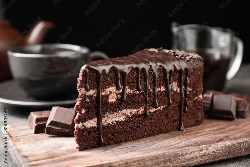 © New Africa - Delicious chocolate cake on grey table, closeup