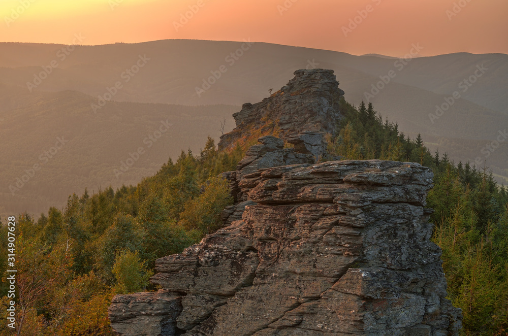 Big rocks at orange romantic sunset in Jeseniky Czech Republic