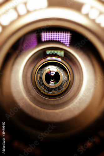 Conceptual design business card of the photographer.Camera lens in the background for conceptual design. Dark background. Technological concept. Business concept.