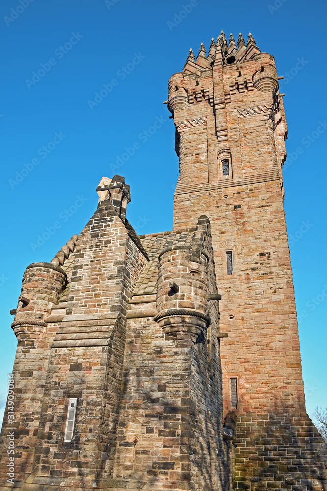 Wallace Monument in Stirling, Scotland. Clear blue sky background. Portrait orientation. This is a national monument to William Wallace.