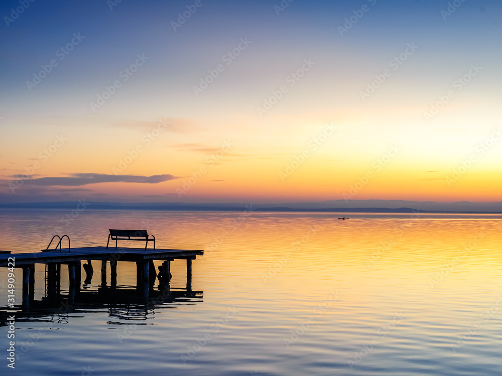 Jetty on lake neusiedlersee in burgenland at sunset Jetty on lake neusiedlersee in burgenland at sunset