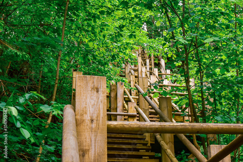 steep zigzag-shaped wooden stairs up steep hill