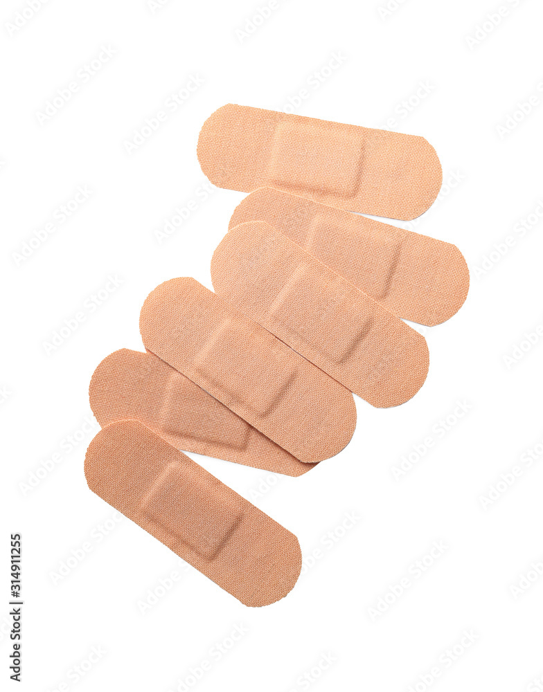 Medical sticking plasters isolated on white. First aid item Medical sticking plasters isolated on white. First aid item