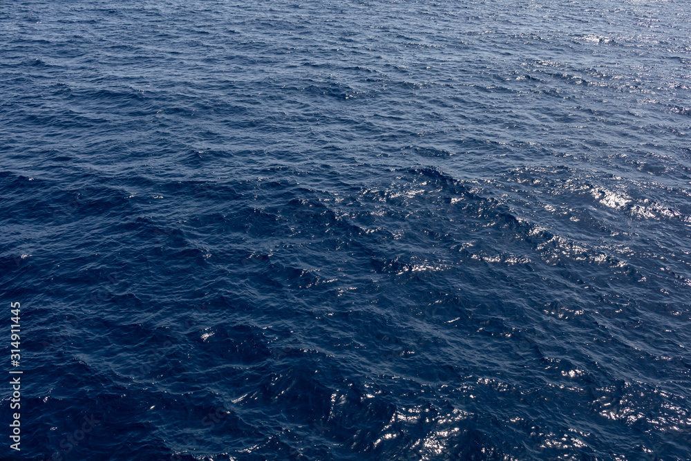 Fototapeta premium sea water background.Waving water surface of the blue sea background