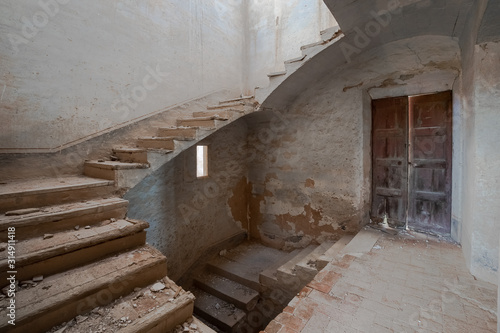 Stairway of an abandoned and ruined house