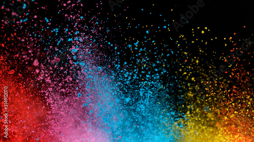 Explosion of colored powder isolated on black background