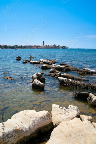 View from the rocky coast near Porec to the old town