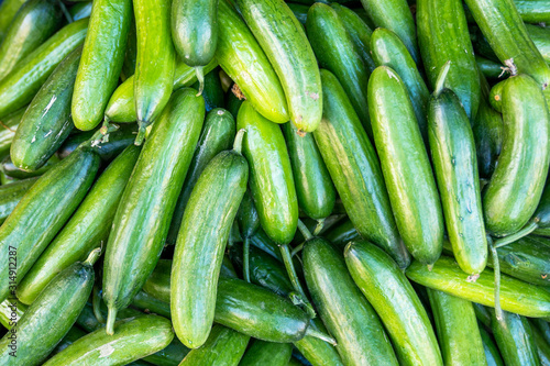 A pile of very delicious exotic vegetables, cucumber in a grocery.