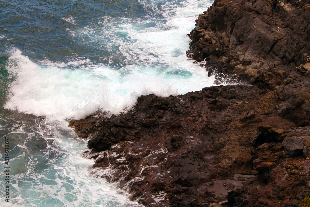 Waves hitting the rocks Waves hitting the rocks
