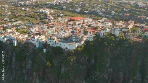 Scenic cinematic aerial view of Church of Our Lady of the Presentation (Iglesia de Nuestra Señora de la Candelaria) in small village Moya on Gran Canaria Gran Canaria on Canary Islands in Spain.