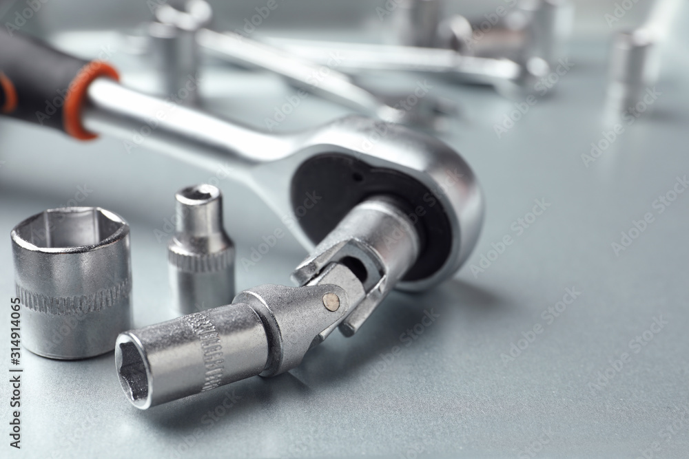 Auto mechanic's tools on metallic surface, closeup Auto mechanic's tools on metallic surface, closeup