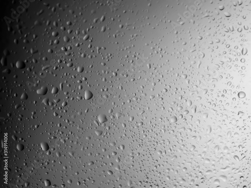 water drops on glass background.Water drops on glass on black background.