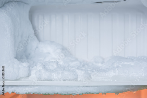large amount of ice in freezer photo