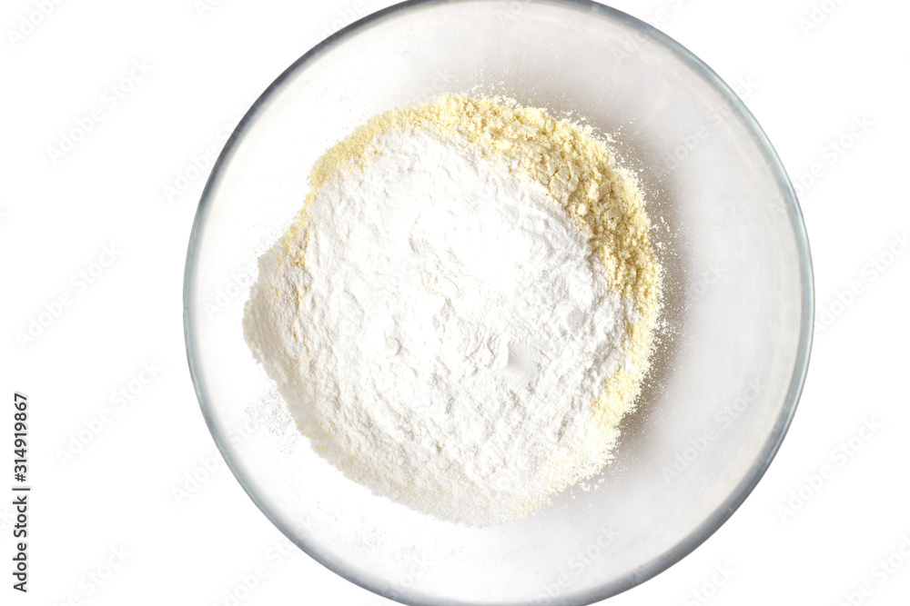 Corn and rice flour in the transparent plate. White background. Copy space. Place for text and design. Gluten-free recipes. Healthy food. Corn and rice flour in the transparent plate. White background. Copy space. Place for text and design. Gluten-free recipes. Healthy food.