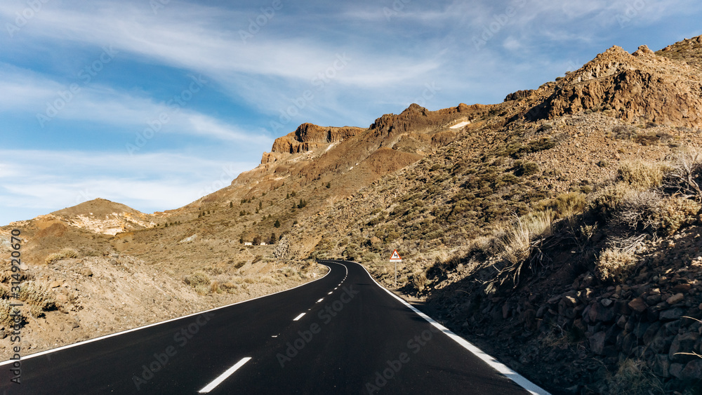 Mountain asphalt road in the mountains. Asphalt in the mountains is black. Beautiful road in the mountains.