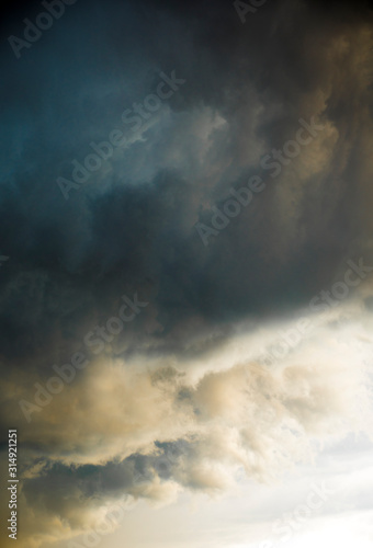Background of threatening clouds laden with rain. Black thunderstorm clouds. Dramatic sky with clouds