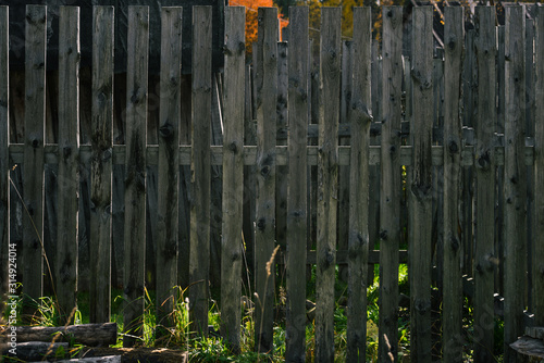Wooden old fence. Countryside and abandoned village plot