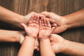 Three hands of family. Love, togetherness, happiness in family concept.