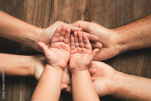 Three hands of family. Love, togetherness, happiness in family concept. photo