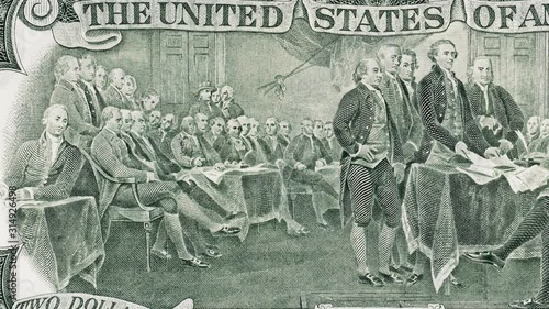 Signing declaration of independence at 4 of July 1776 on US two dollar bill tracking macro. United States dollar close up. Slider shot. 4K
