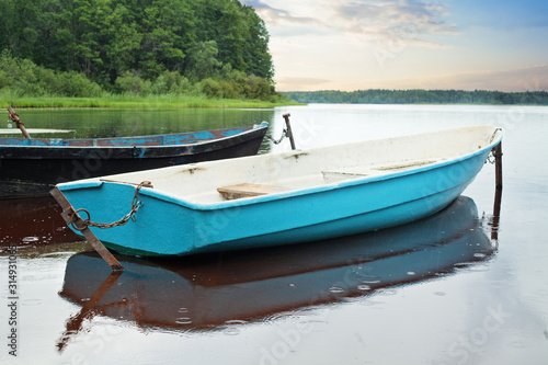 Fototapeta Naklejka Na Ścianę i Meble -  Boats On The Lake. Morning nature before fishing