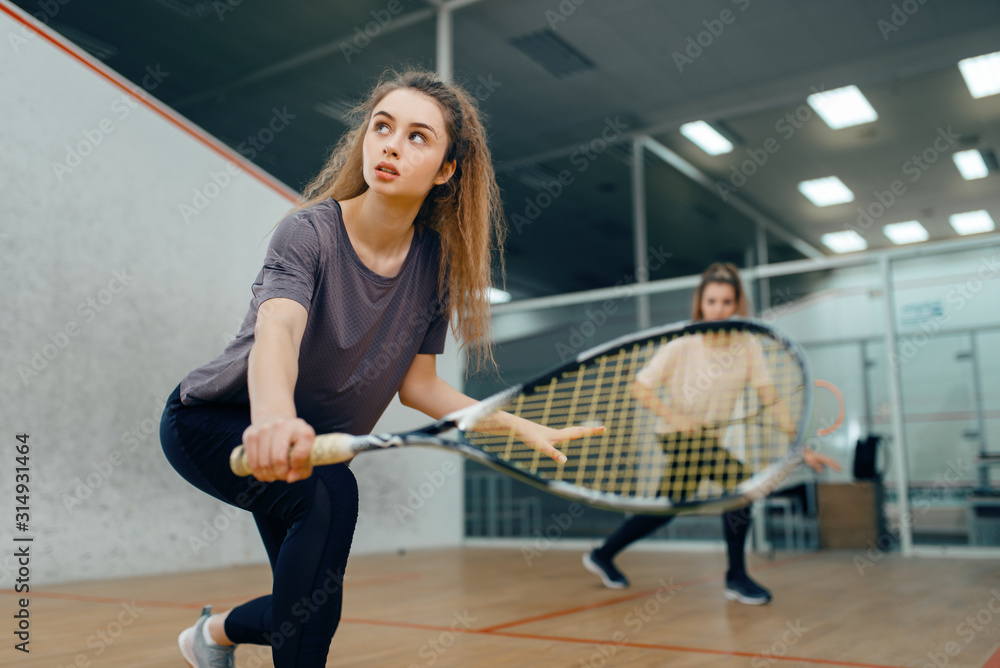 Fotografie Two players with squash racket playing on court