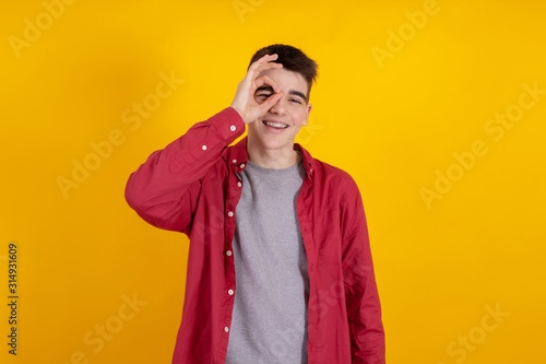 young teenage man or student isolated on color background