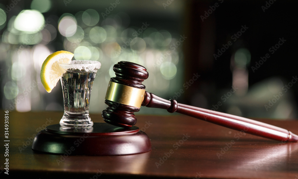 the concept for drink driving.judge hammer, lemon glass and tequila. Do not drink alcohol and do not drive the concept. the concept for drink driving.judge hammer, lemon glass and tequila. Do not drink alcohol and do not drive the concept.
