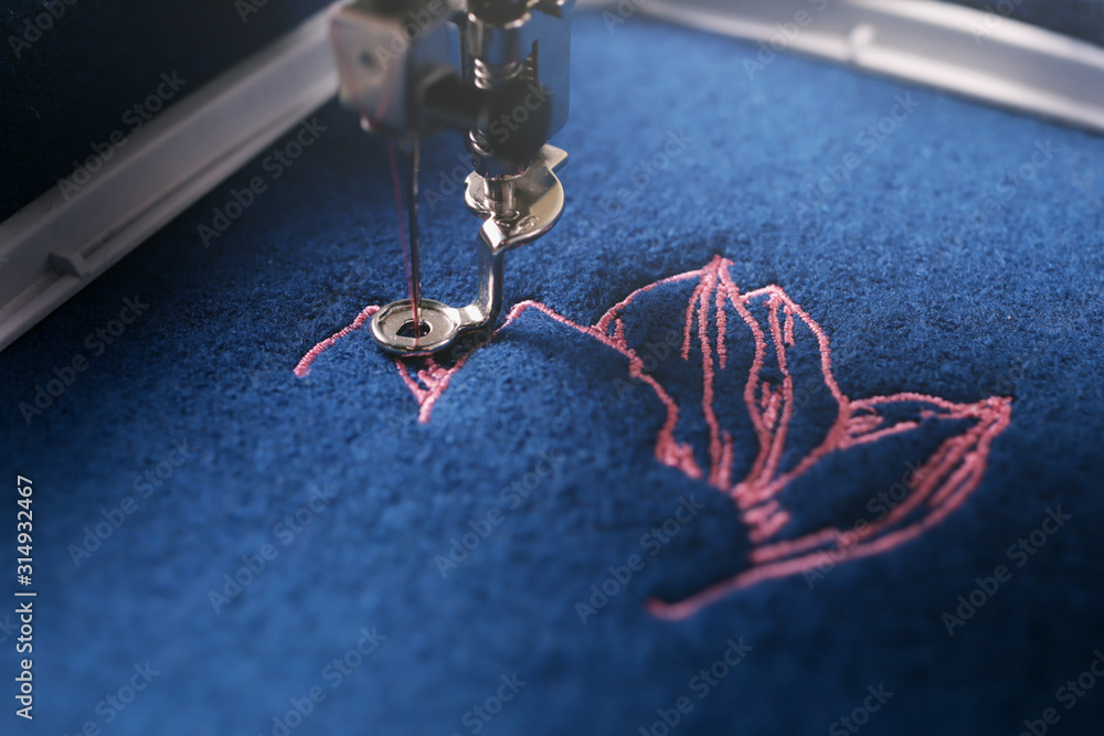 Embroidery of a Light Pink Magnolia on Classic Blue Boiled Wool and Needle,  Foot and Needle Bar of a Embroidery Machine Stock Image - Image of blanked,  luxury: 169112903