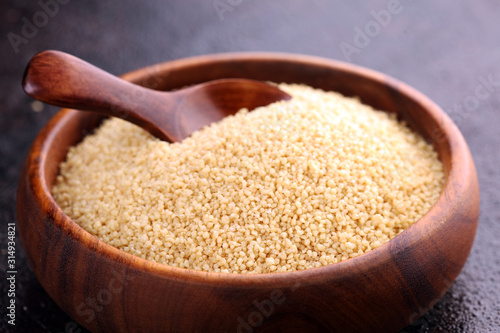 Couscous in a wooden spoon. healthy food © beats_