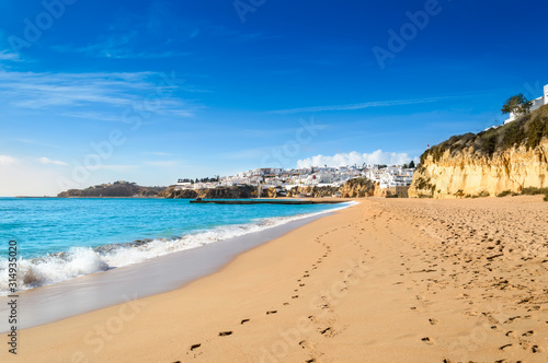 Sandy beach in Albufeira resort village in Algarve, Portugal. photo