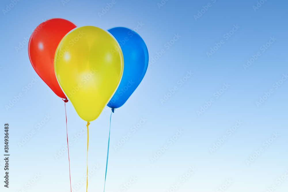Colorful balloons for birthday and celebrations isolated at blue sky