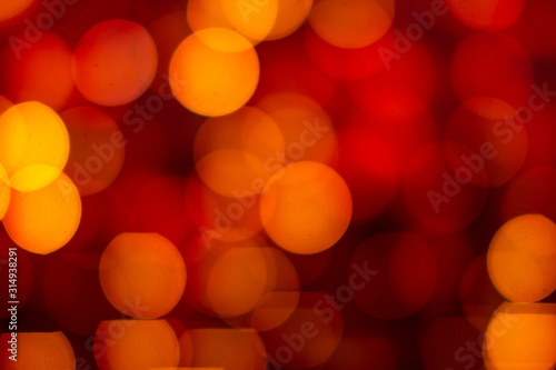 Red and yellow abstract background with bokeh defocused blurred lights © vladim_ka