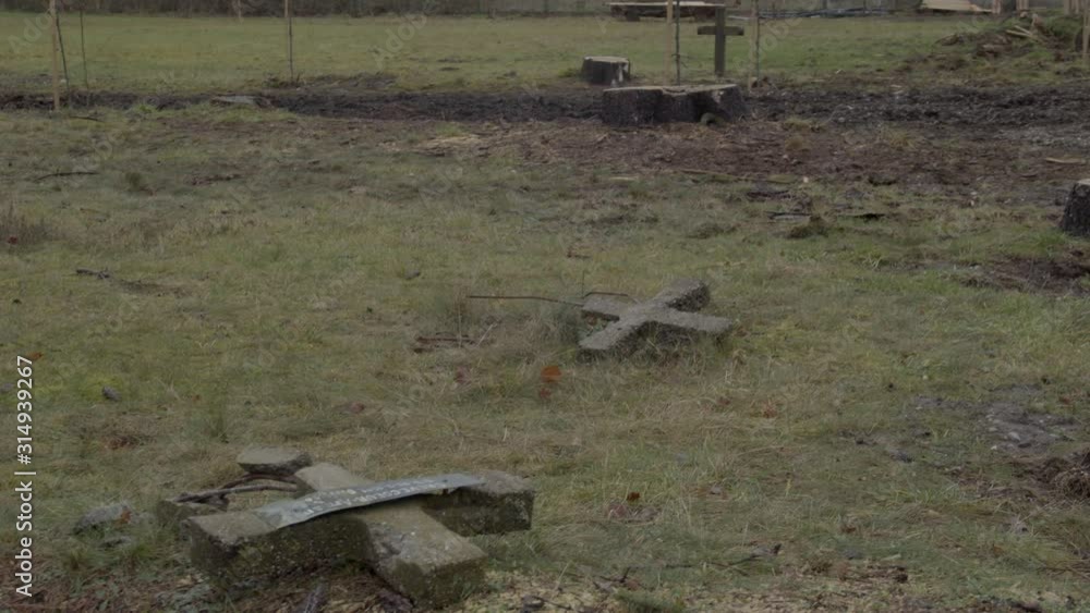 Broken crucifixes lying on the ground Broken crucifixes lying on the ground