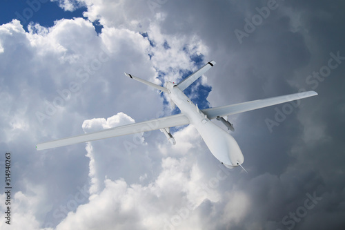 military RC military drone flies flies against backdrop of beautiful ominous clouds on blue sky background