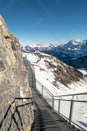 The Thrill Walk at Birg in the Swiss Alps. The steel structure hugs the cliff side and there is a vertical drop beneath. The views of the mountains are stunning. Not for the faint hearted.