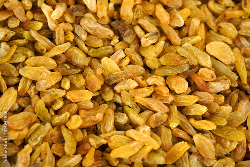  Long golden raisins as background