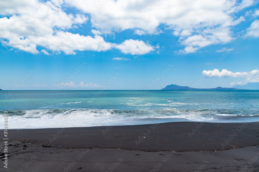 Black sand beach near by the town Ende. Ende, East Nusa Tenggara, Flores, Indonesia.