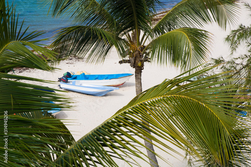 Motorboats at white sand of...