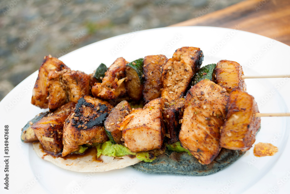 Chicken skewers fried in sesame oil, cuisine with oriental flavor in Guatemala, Central America. Chicken skewers fried in sesame oil, cuisine with oriental flavor in Guatemala, Central America.