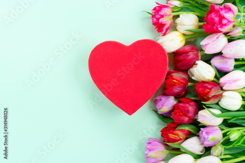 Fresh tulips flowers with heart