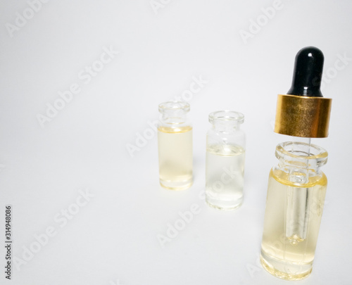 Close up of dropper with CBD. CBD pipette. Bottle of Cannabis oil. Oil bottles on white background. Medical cannabis concept. Spruce cbd oil. Oil cbd stock images