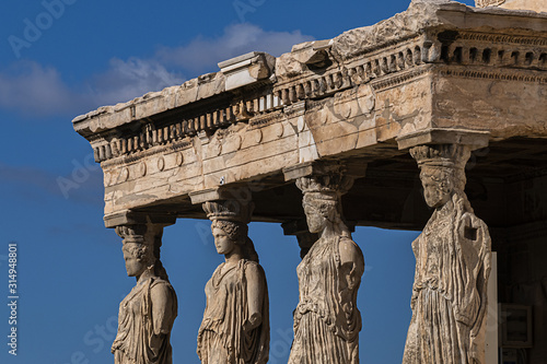 The Erechtheion (or Erechtheum, 406 BC) with Caryatids - ancient Greek temple on the north side of the Acropolis. Erechtheion dedicated to both Athena and Poseidon. Athens, Greece.